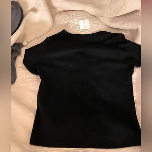 Going out black top. Could possibly work as a semi crop top. Its a great basic!